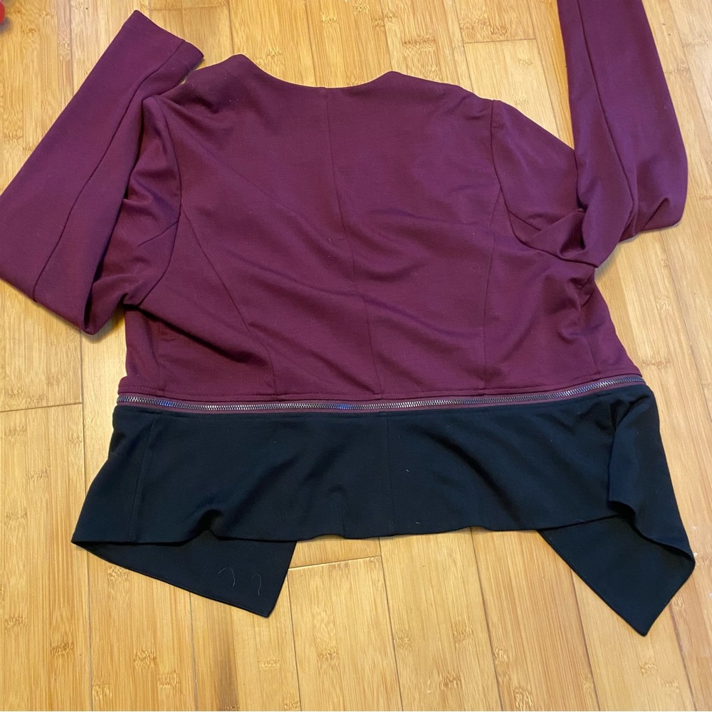 Torrid jacket. Eggplant with black trim zip off peplum. Open front. Size 1